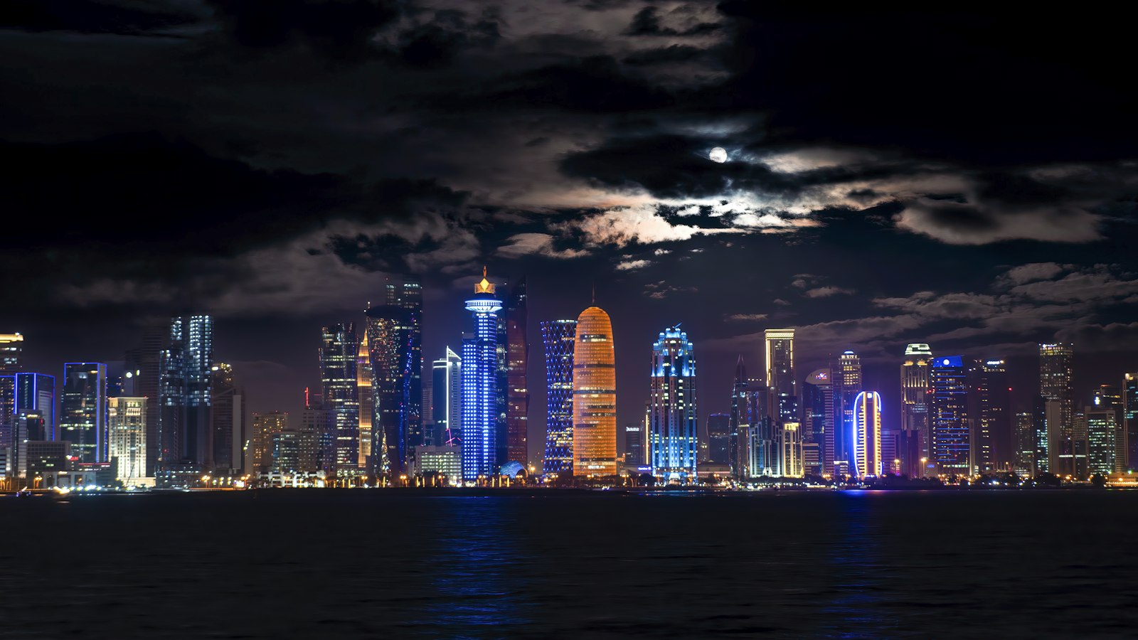 Doha West Bay skyline at night, seen from across the bay